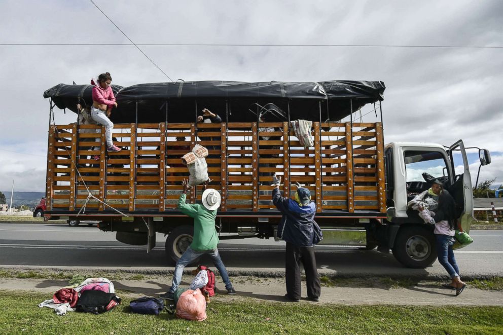 PHOTO: The Mendoza Landinez and Lomelly families get off a truck on the Pan-American Highway on their way to Peru, Aug. 23, 2018.