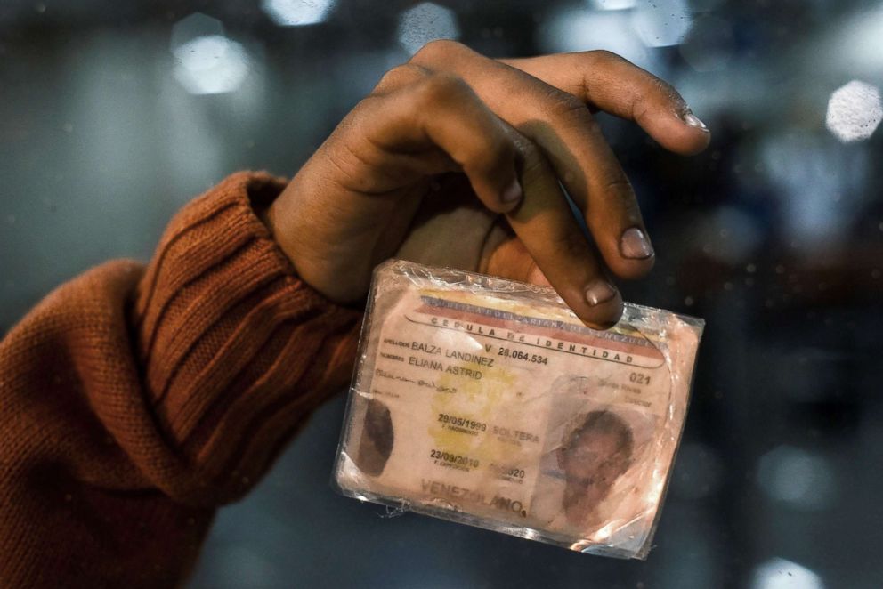 PHOTO: Eliana Balza shows her damaged Venezuelan identity card, after the Ecuadoran authorities banned her from entering the country, at the Ecuadoran migrations office at the border between Ipiales in Colombia and Tulcan in Ecuador, Aug. 24, 2018.