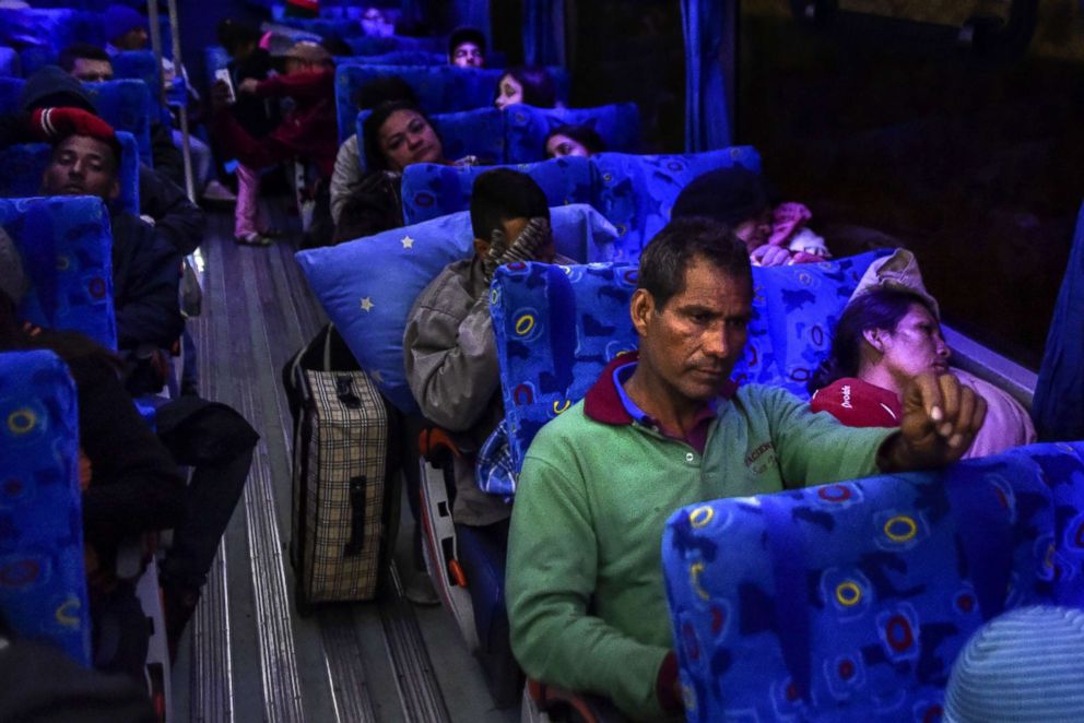 PHOTO: Joel Mendoza and his partner Edicth Landinez, right, travel to the border with Peru on a bus provided by Ecuadoran authorities as part of a "humanitarian corridor" for Venezuelans fleeing their country's economic crisis, Aug. 24, 2018.