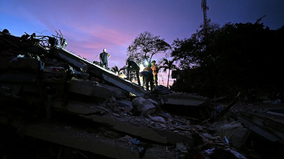 PHOTO: Volunteers and Ecuadorean firefighters of the Urban Search and Rescue (USAR) search for bodies at the site of a collapsed building in Caraballeda, La Guaira State, Venezuela on June 28, 2026, following twin earthquakes.