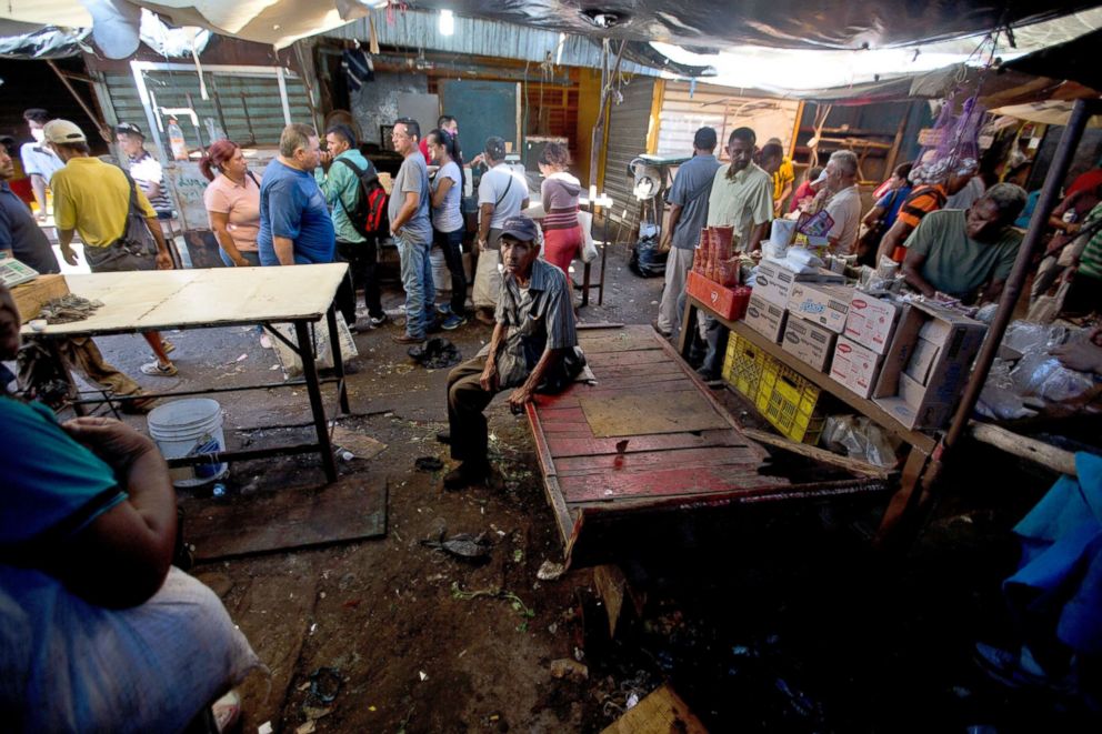 PHOTO: Customers stand in a practically empty Las Pulgas market, where vegetables and fruit are normally sold, in Maracaibo, Venezuela, Aug. 19, 2018.