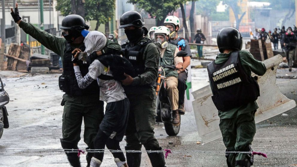 An anti-government activist is arrested during clashes in Caracas, July 28, 2017. 

