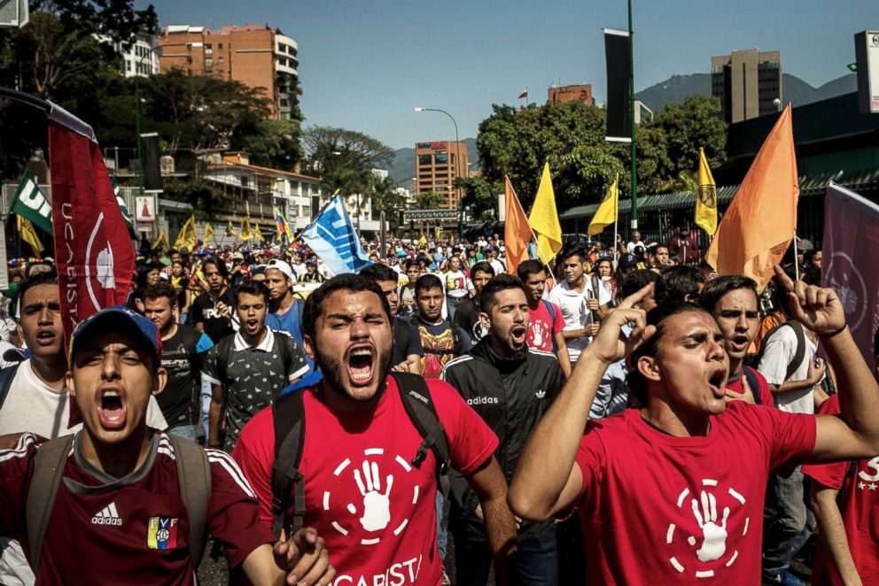  Venezuelan opposition supporters march in a demonstration protesting the authoritarian rule of President Nicolas Maduro of Venezuela in Caracas, Feb. 2, 2019.
     