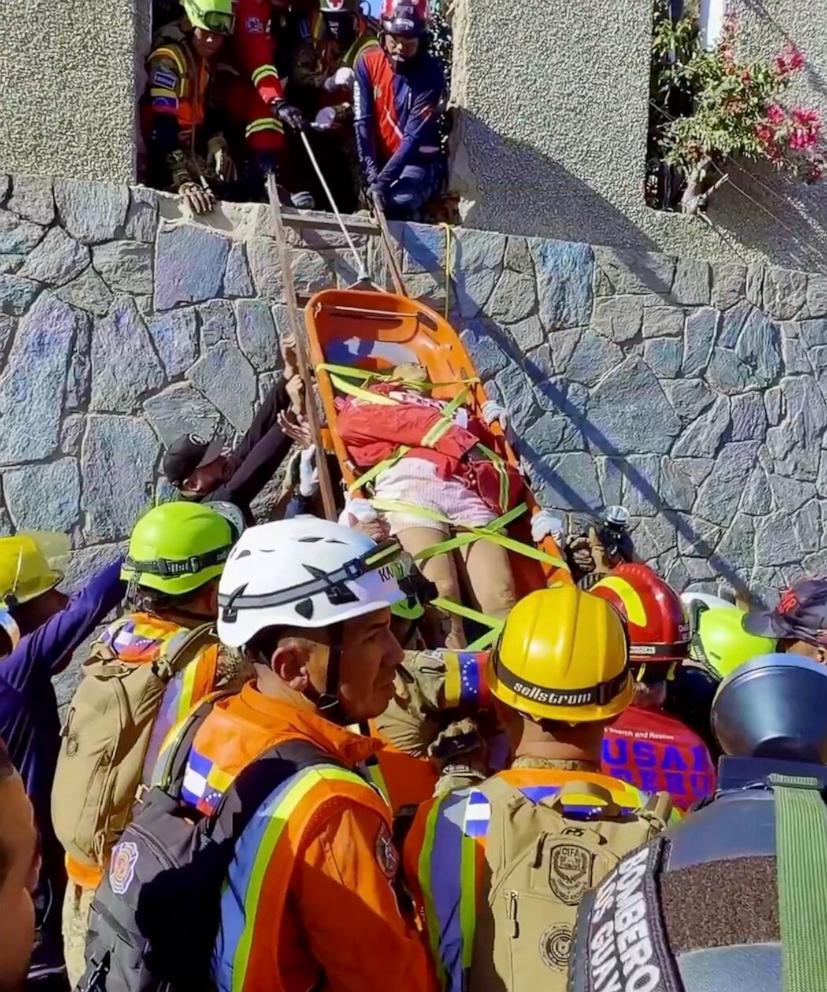 PHOTO: A woman is seen after being pulled from under a collapsed building in a hard hit town in La Guaira, on Venezuela's coast, in an image shared by the Salvadoran president.