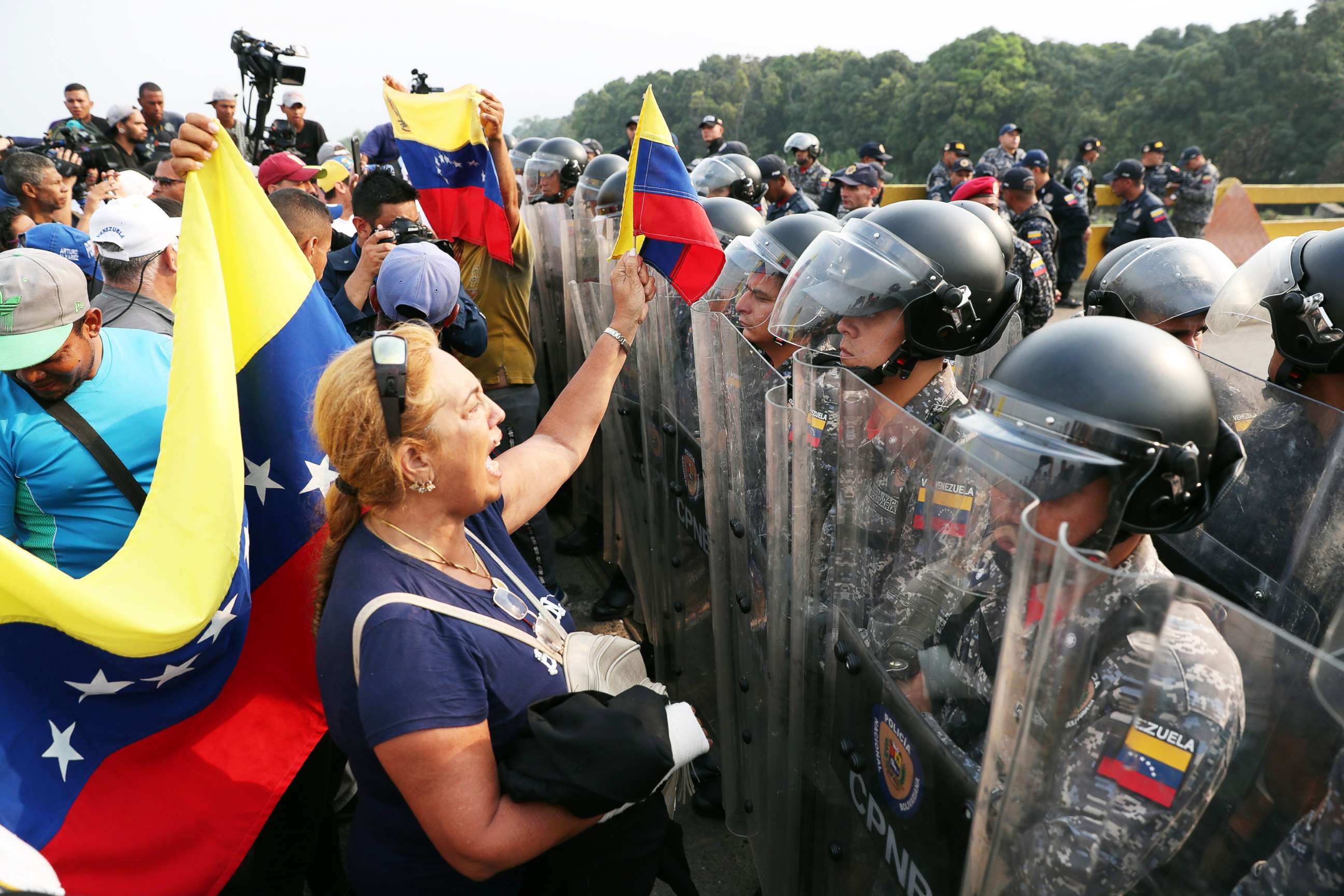 PHOTO: Venezuelans stand in front of Venezuelan Army forces members at the Simon Bolivar bridge on the border with Venezuela, in Cucuta, Colombia, Feb. 23, 2019.