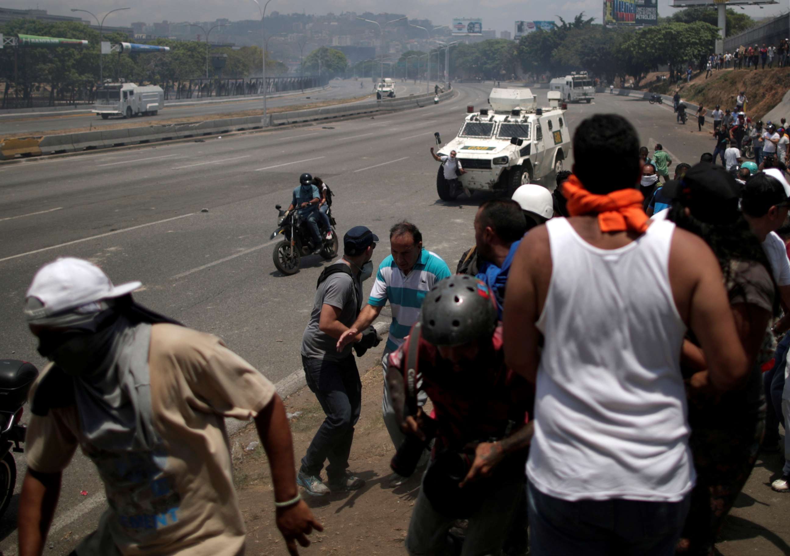 PHOTO: An opposition demonstrator is struck by a Venezuelan National Guard vehicle on a street near the Generalisimo Francisco de Miranda Airbase "La Carlota" in Caracas, Venezuela, April 30, 2019.