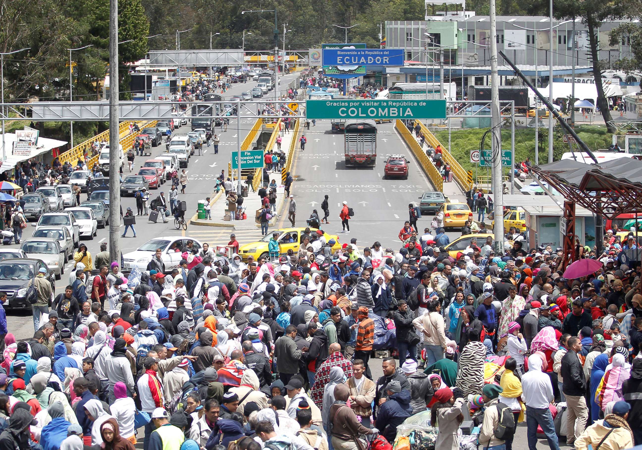 PHOTO: Venezuelan migrants stand in line to register their exit from Colombia before entering into Ecuador, at the Rumichaca International Bridge, Colombia, Aug. 9, 2018.