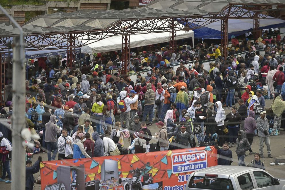 PHOTO: Venezuelan citizens are seen at the Rumichaca international bridge before leaving to Ecuador, in Ipiales, Colombia, Aug. 11, 2018.