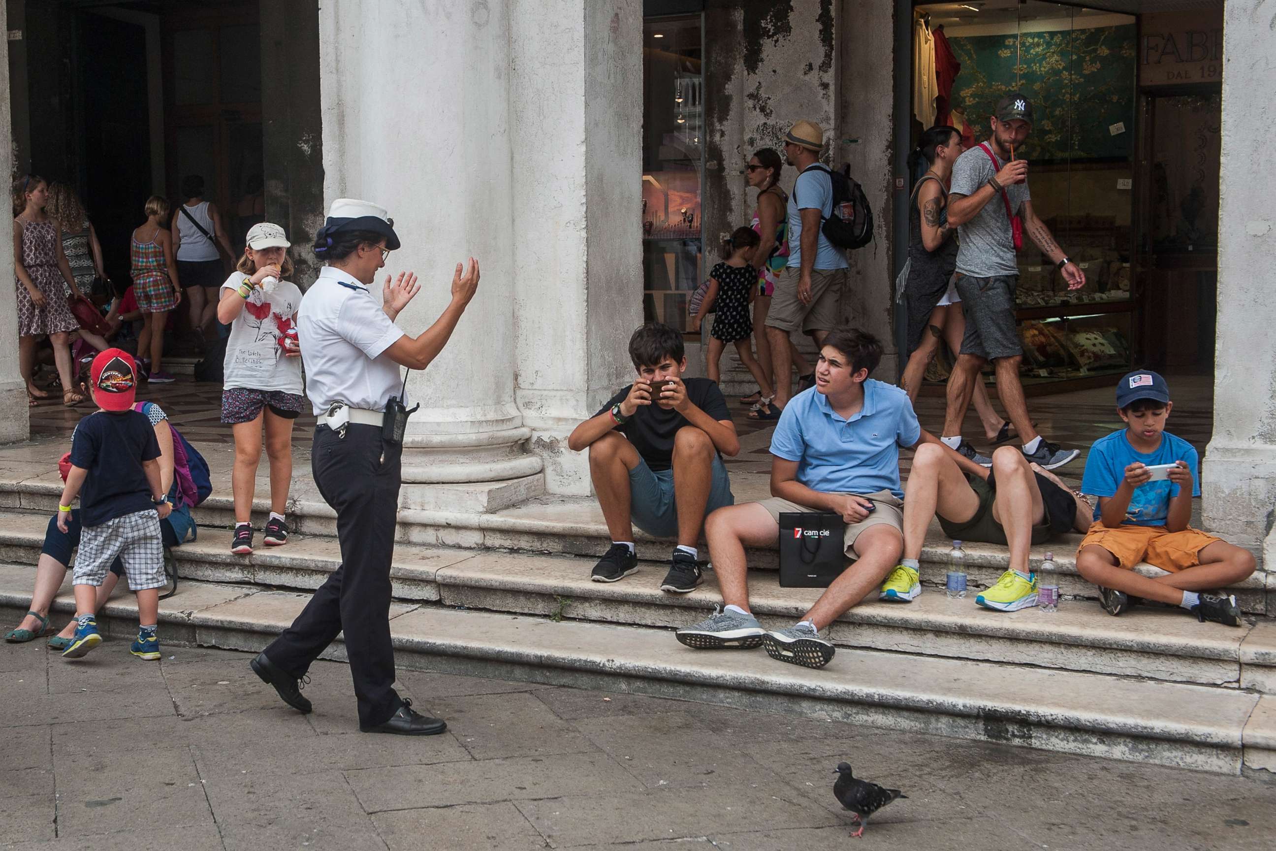 PHOTO: A local police officer tells tourists to move away from Saint Mark's Square on Aug. 14, 2017 in Venice, Italy.