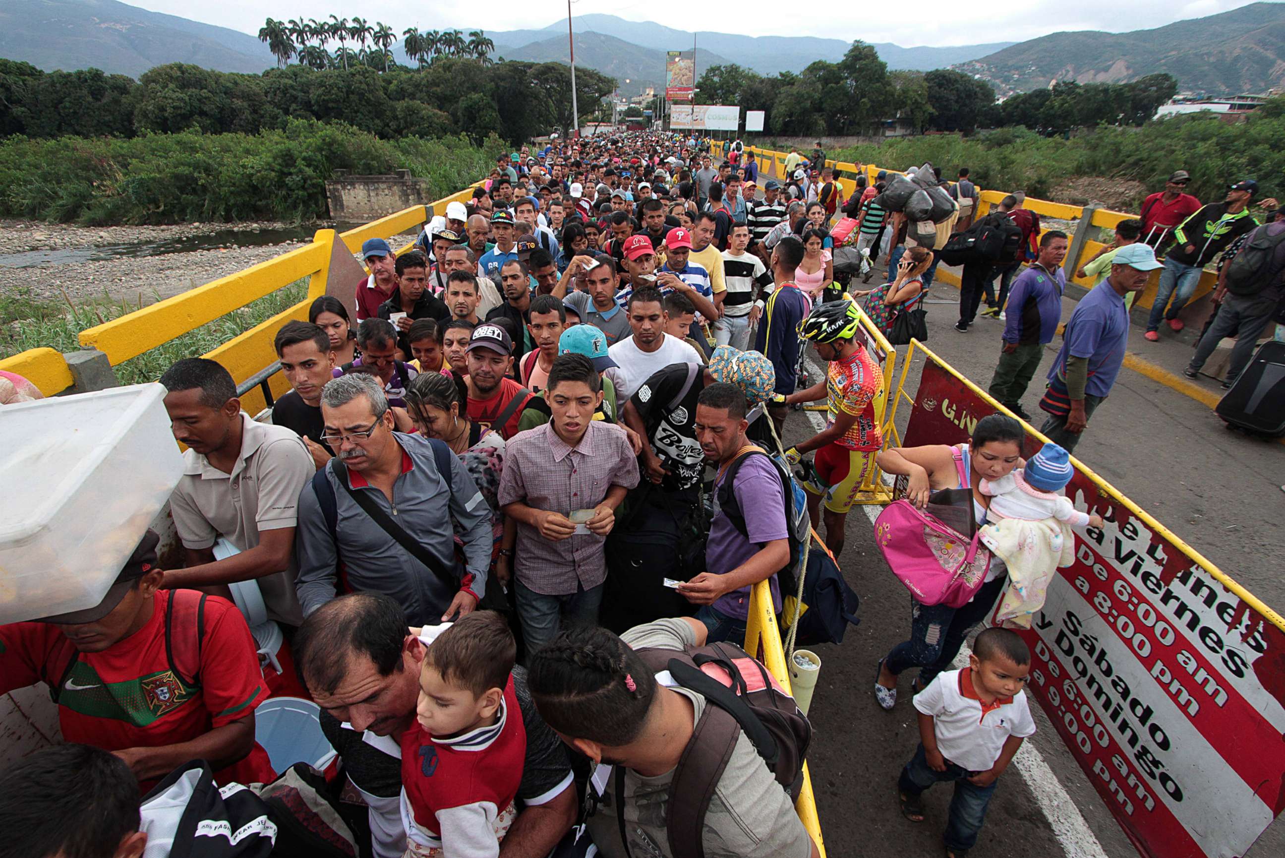 PHOTO: Venezuelan citizens cross the Simon Bolivar international bridge from San Antonio del Tachira in Venezuela to Norte de Santander province of Colombia on Feb. 10, 2018.