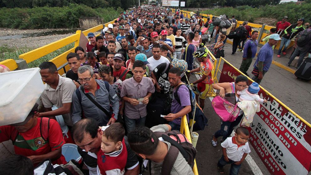 PHOTO: Venezuelan citizens cross the Simon Bolivar international bridge from San Antonio del Tachira in Venezuela to Norte de Santander province of Colombia on Feb. 10, 2018.