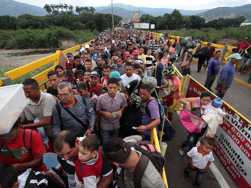 PHOTO: Venezuelan citizens cross the Simon Bolivar international bridge from San Antonio del Tachira in Venezuela to Norte de Santander province of Colombia on Feb. 10, 2018.