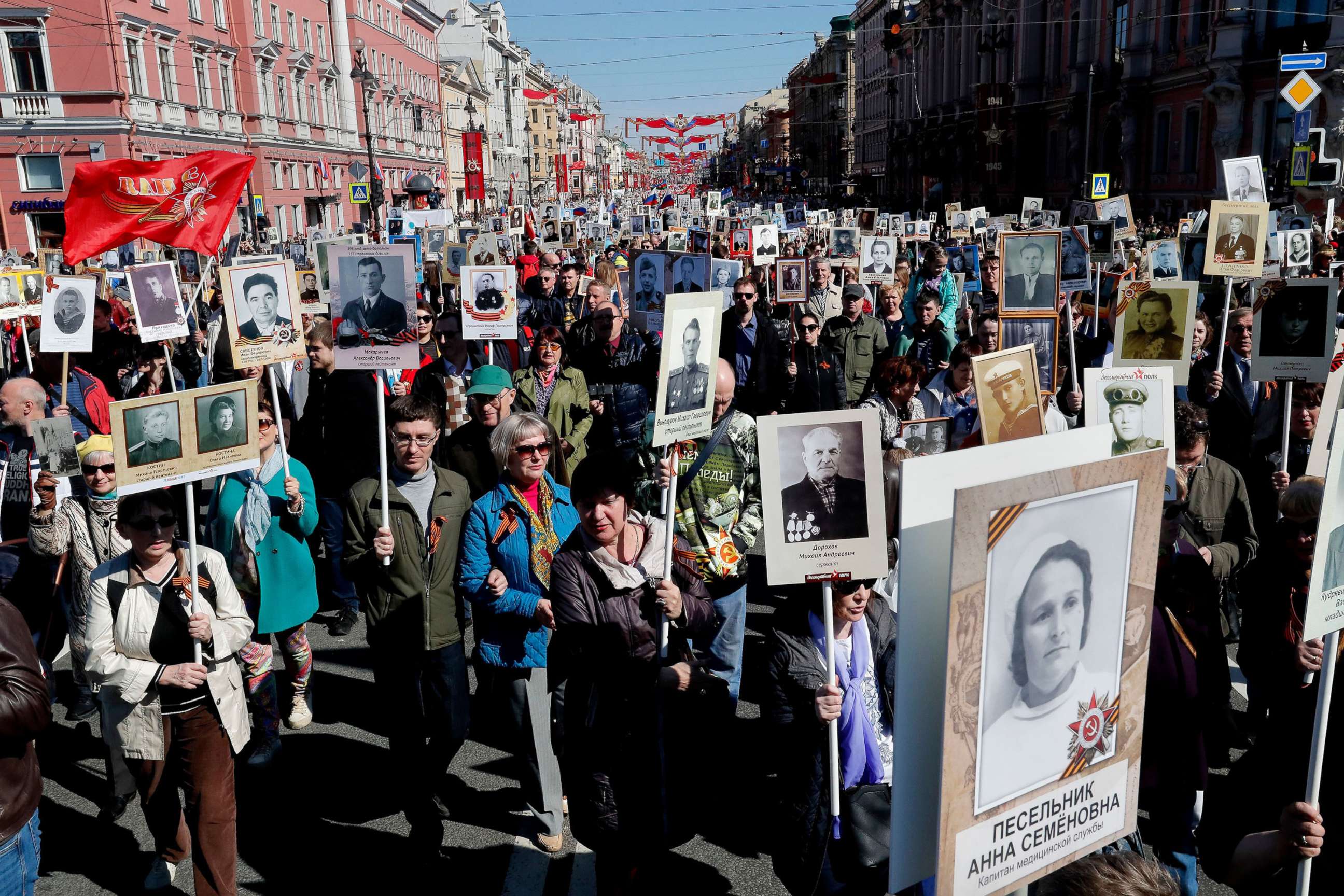 PHOTO:Russian people take part in the Immortal Regiment memorial demonstration with portraits of their relatives, who participated in World War II, in central St. Petersburg, Russia, May 9, 2019.