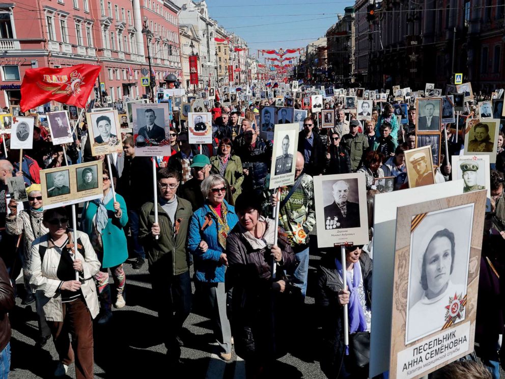 PHOTO:Russian people take part in the Immortal Regiment memorial demonstration with portraits of their relatives, who participated in World War II, in central St. Petersburg, Russia, May 9, 2019.