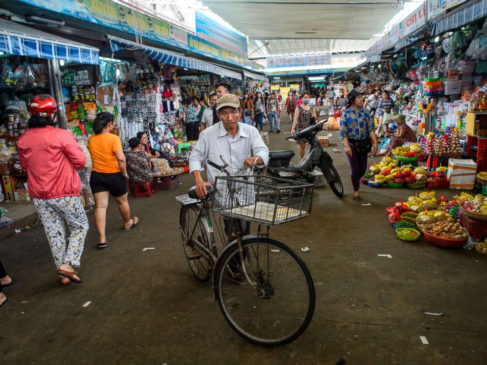 PHOTO: A man walks with his bicycle in the Con Market in the central Vietnamese city of Danang in this Nov. 11, 2017 file photo.