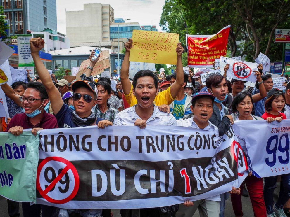 PHOTO: Vietnamese protesters shout slogans against a proposal to grant companies lengthy land leases during a demonstration in Ho Chi Minh City, June 10, 2018.