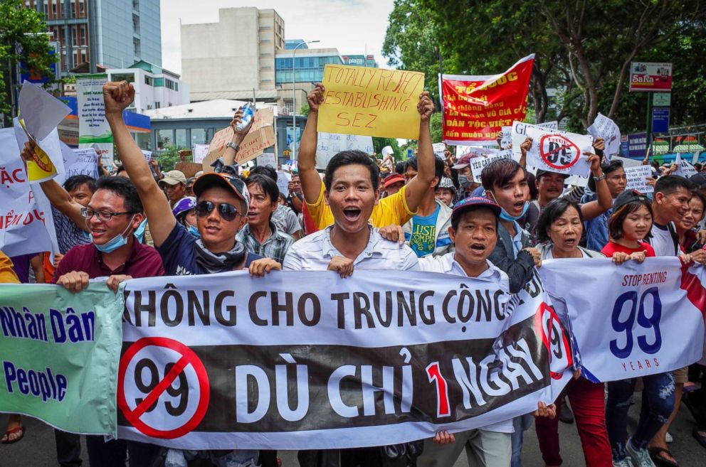 PHOTO: Vietnamese protesters shout slogans against a proposal to grant companies lengthy land leases during a demonstration in Ho Chi Minh City, Vietnam, June 10, 2018.