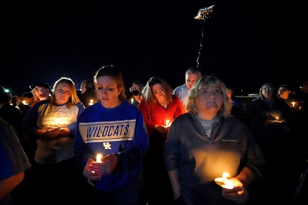 PHOTO: People participate in a candlelight vigil in the aftermath of tornadoes that tore through the region, in Mayfield, Ky., Dec. 14, 2021.