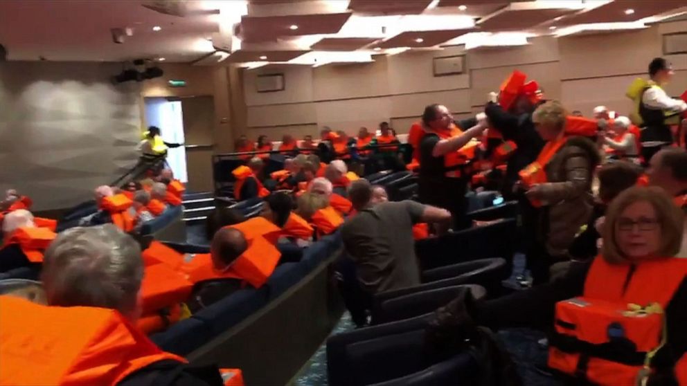 PHOTO: This image grab from a handout video made available to AFTV, March 24, 2019, by a passenger onboard the cruise ship Viking Sky shows fellow passengers gathering in a room with life jackets.