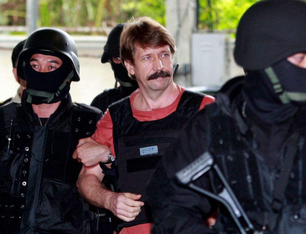 PHOTO: FILE - Suspected Russian arms smuggler Viktor Bout, center, is led by armed Thai police commandos as he arrives at the criminal court in Bangkok, Thailand in Oct. 5, 2010.