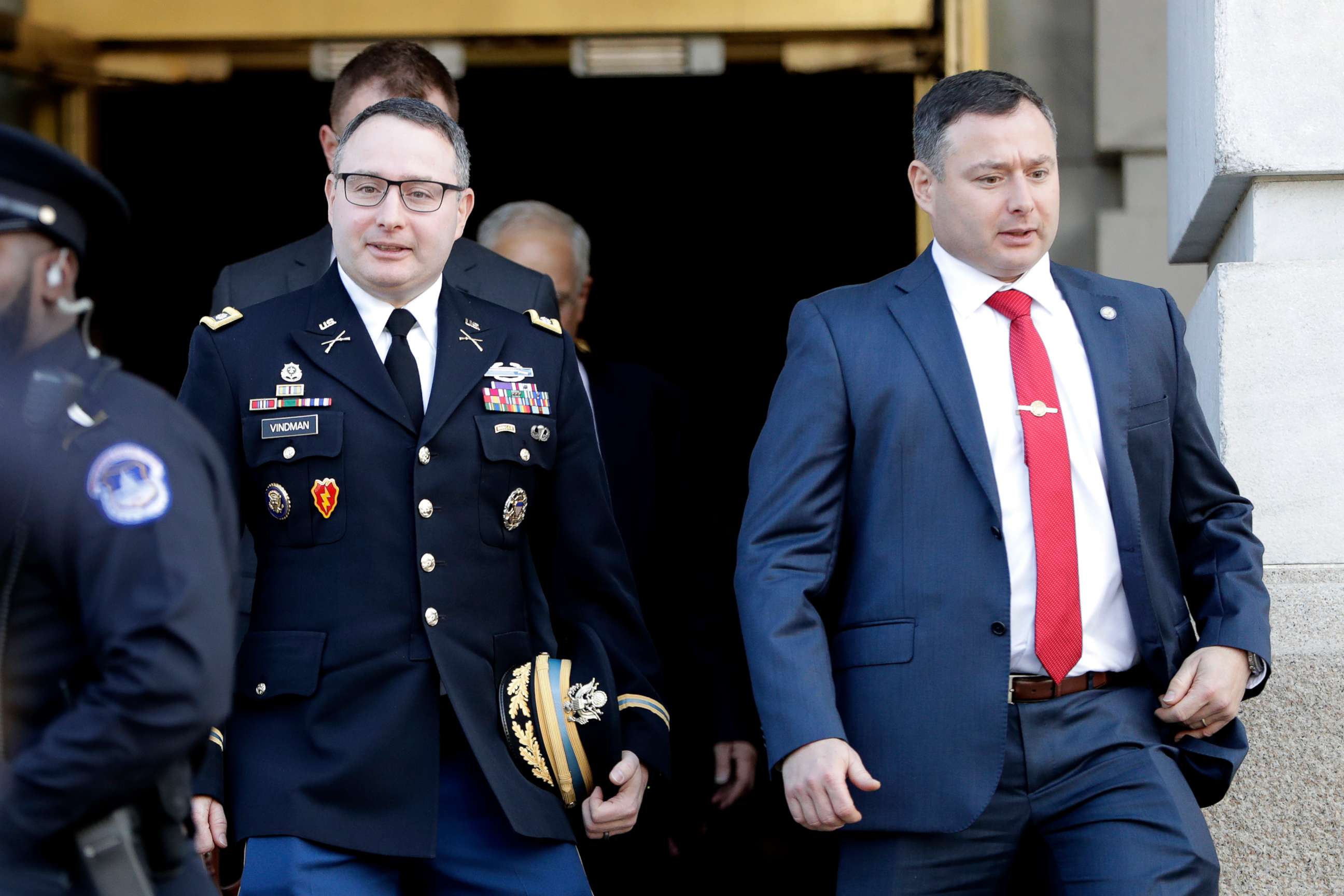 PHOTO: Lt. Col. Alexander Vindman, left, walks with his twin brother, Army Lt. Col. Yevgeny Vindman, after testifying before the House Intelligence Committee on Capitol Hill in Washington, Tuesday, Nov. 19, 2019.