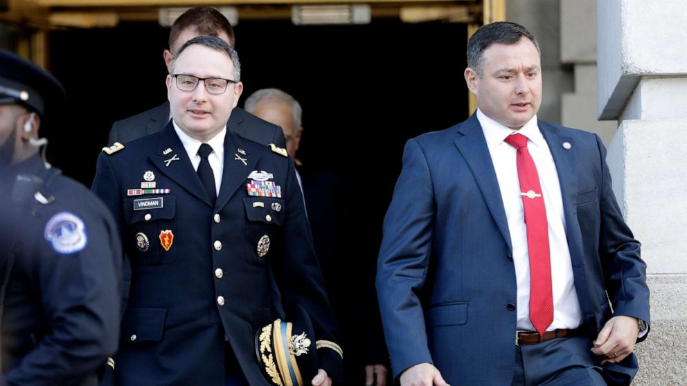 PHOTO: Lt. Col. Alexander Vindman, left, walks with his twin brother, Army Lt. Col. Yevgeny Vindman, after testifying before the House Intelligence Committee on Capitol Hill in Washington, Tuesday, Nov. 19, 2019.