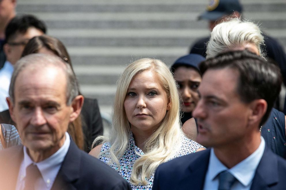 PHOTO: Virginia Giuffre, an alleged victim of Jeffrey Epstein, center, exits from federal court in New York, Aug. 27, 2019..