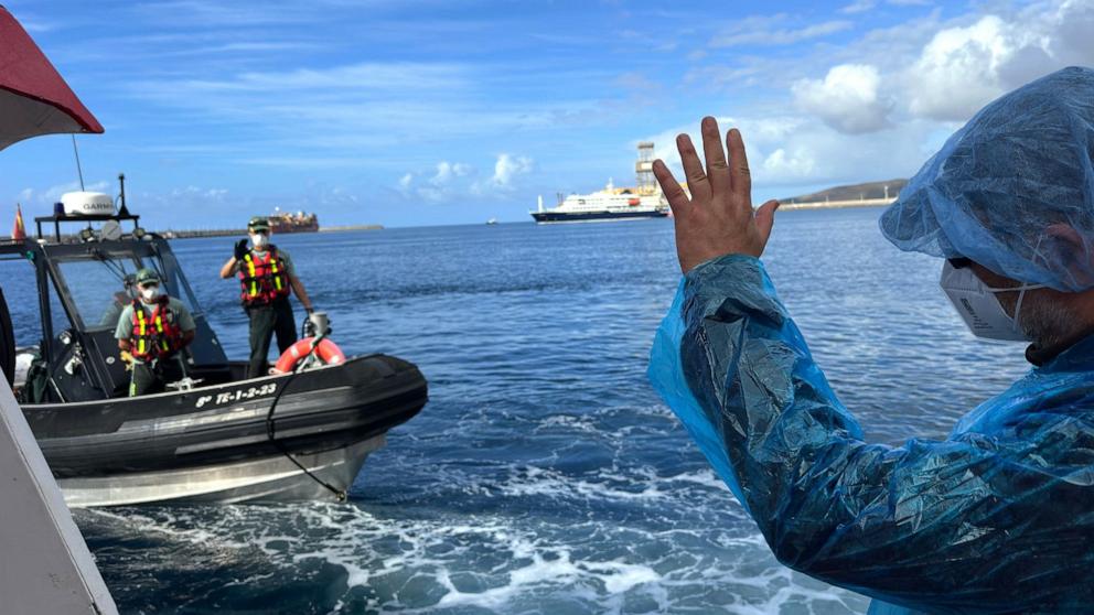 PHOTO: A passenger waves to the Guardia Civil officers as they are disembarked from the hantavirus-stricken cruise ship MV Hondius at the port of Granadilla in Tenerife, Canary Islands, Spain, May 10, 2026.