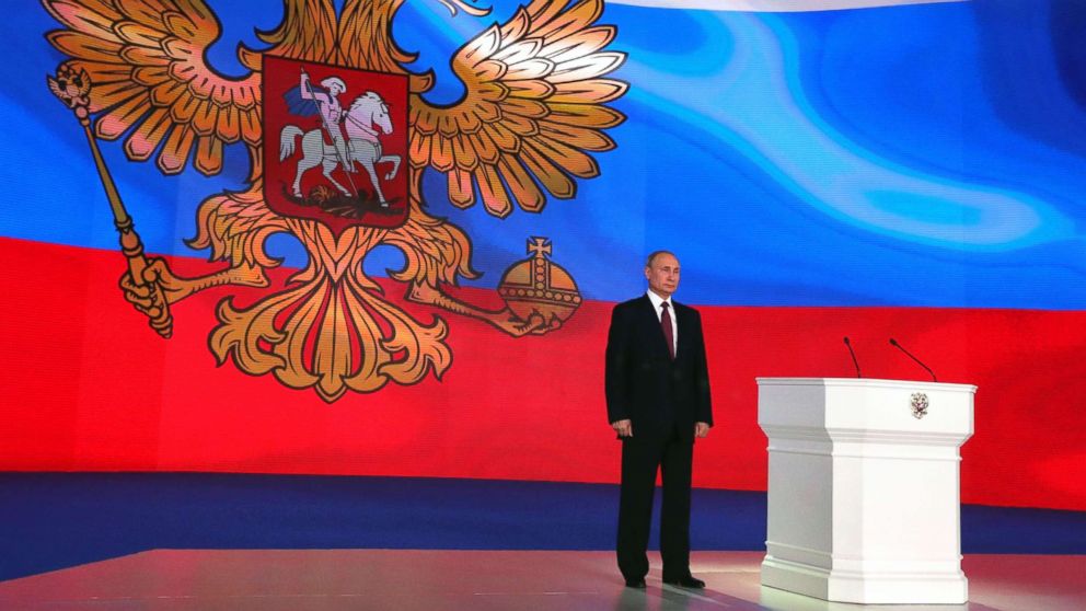 PHOTO: Russian President Vladimir Putin stands on the stage while addressing the Federal Assembly at Moscow's Manezh exhibition centre, March 1, 2018.
