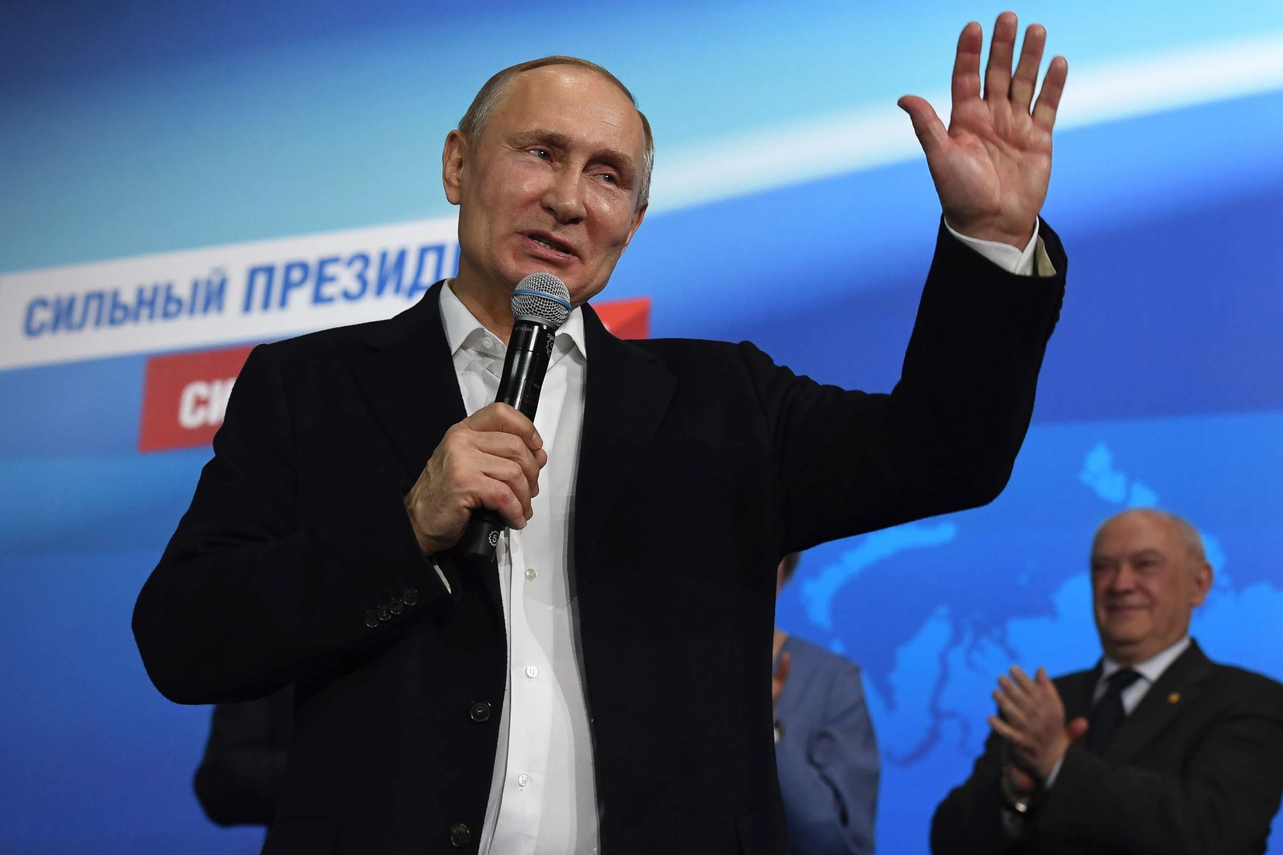 PHOTO: Russian President and Presidential candidate Vladimir Putin gestures as he speaks at his campaign headquarters in Moscow on March 18, 2018.