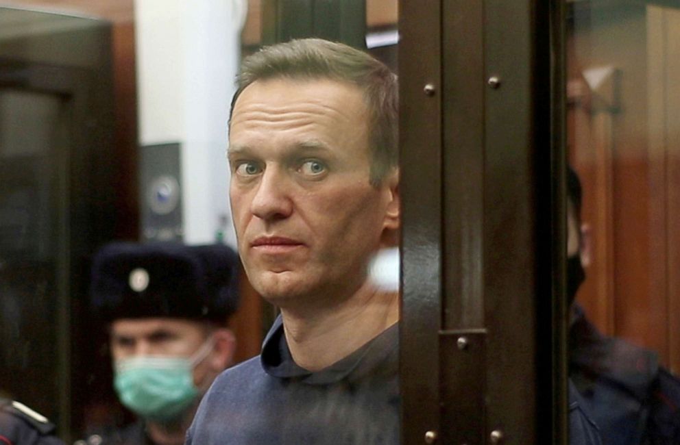 PHOTO: A still image taken from video footage shows Russian opposition leader Alexei Navalny inside a defendant dock during the announcement of a court verdict in Moscow, Feb. 2, 2021. 