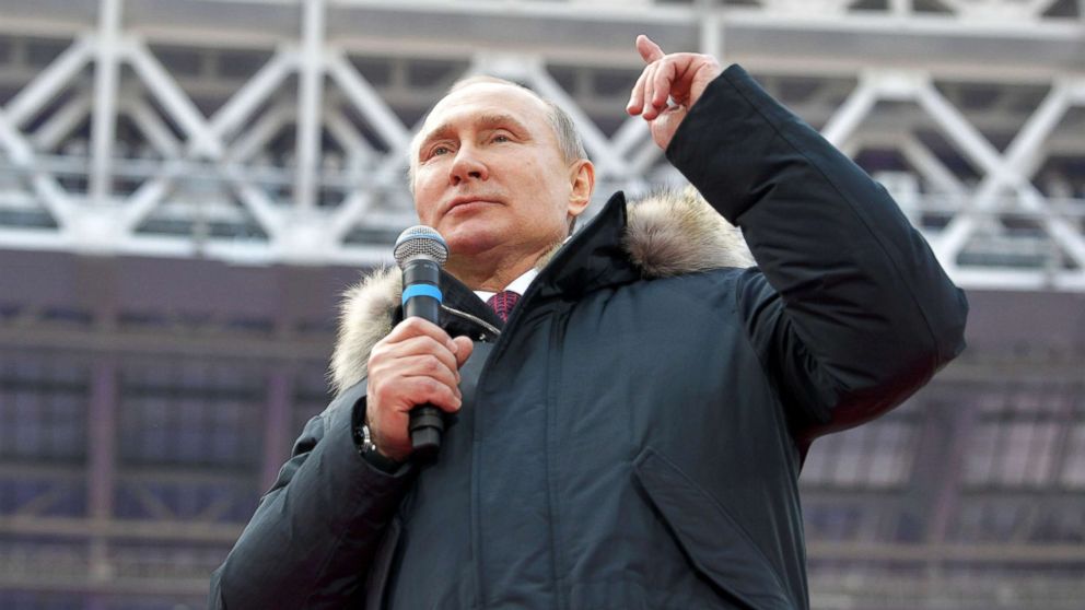 Russian President Vladimir Putin delivers a speech during a rally to support his bid in the upcoming presidential election, at Luzhniki Stadium in Moscow, March 3, 2018.
