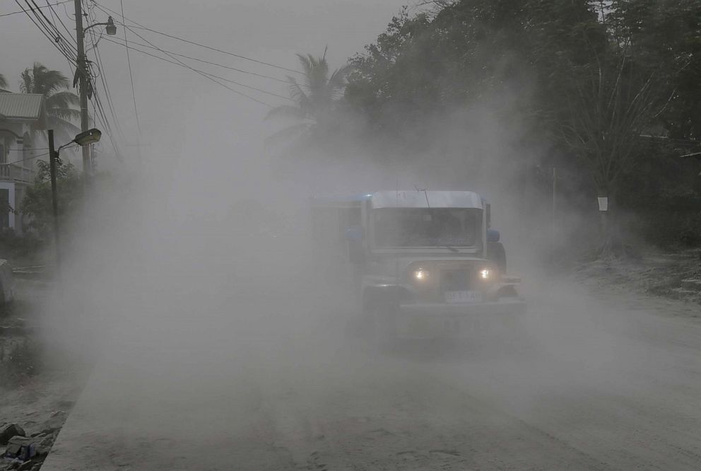 PHOTO: A jeep passes along an ash-covered road during evacuations as Taal volcano continues to erupt in Lemery, Philippines, Jan. 13, 2020. 
