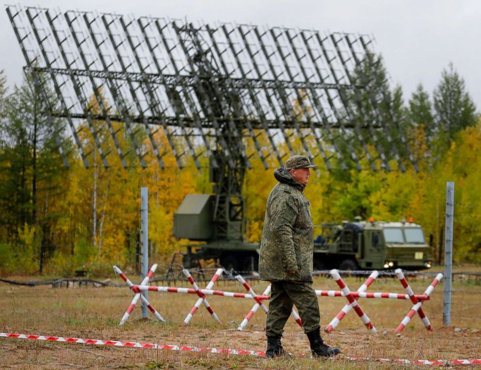 PHOTO: A Russian walks past a Nebo-M radar deployed in a forest during the military exercises Vostok 2018 in Eastern Siberia, Russia, Sept. 12, 2018.