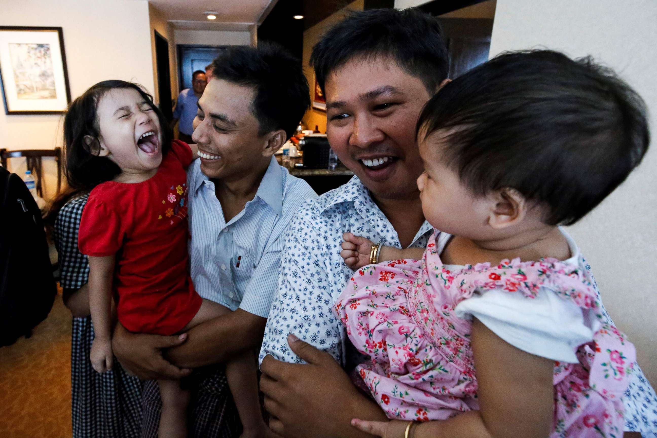 PHOTO: Reuters journalists Wa Lone and Kyaw Soe Oo celebrate with their children after being freed freed from Insein prison after a presidential amnesty in Yangon, Myanmar, May 7, 2019.