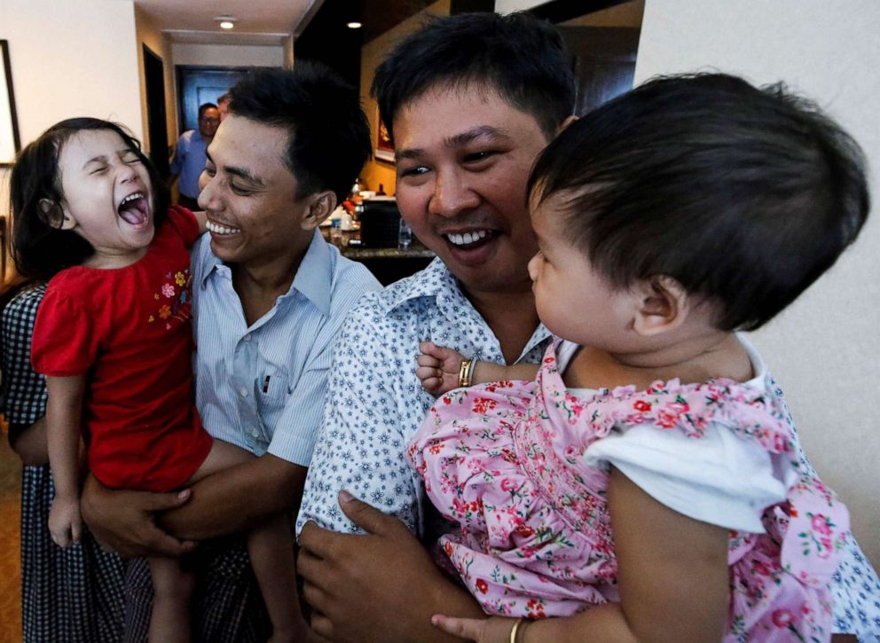 PHOTO: Reuters journalists Wa Lone and Kyaw Soe Oo celebrate with their children after being freed freed from Insein prison after a presidential amnesty in Yangon, Myanmar, May 7, 2019.