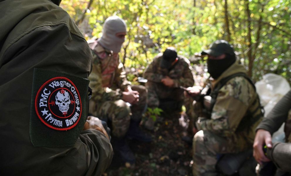 PHOTO: In this Oct. 7, 2022, file photo, servicemen of Russian private military company Wagner Group execute a combat mission in the course of Russia's military operation in Ukraine, in Luhansk.
