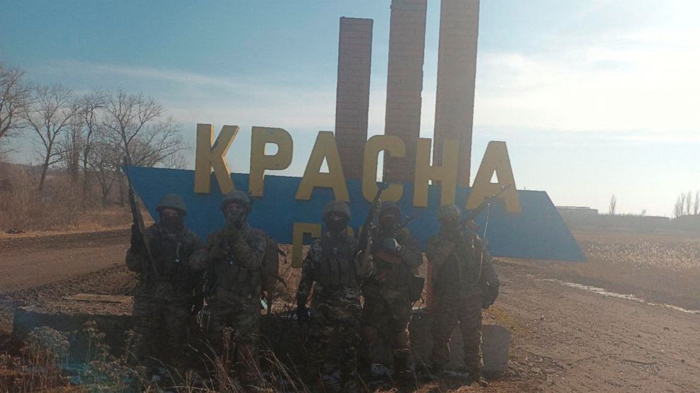 PHOTO: An image, released by founder of Russia's Wagner Group Yevgeny Prigozhin's press service, shows what it said to be Wagner fighters posing for a picture at the entrance sign to the village of Krasna Hora near the embattled city of Bakhmut, Ukraine.