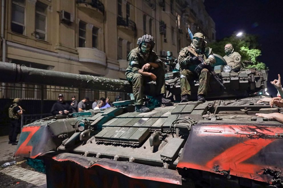 PHOTO: In this June 24, 2023, file photo, members of the Wagner Group military company sit atop of a tank on a street in Rostov-on-Don, Russia, prior to leaving an area at the headquarters of the Southern Military District.
