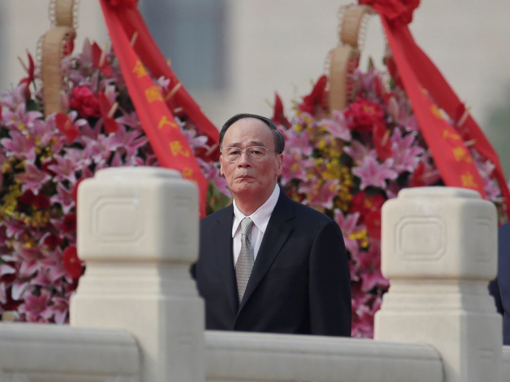 PHOTO: Chinas Politburo Standing Committee member Wang Qishan, the head of Chinas anti-corruption watchdog, attends a tribute ceremony in front of the Monument to the Peoples Heroes at Tiananmen Square, in Beijing, Sept. 30, 2017.