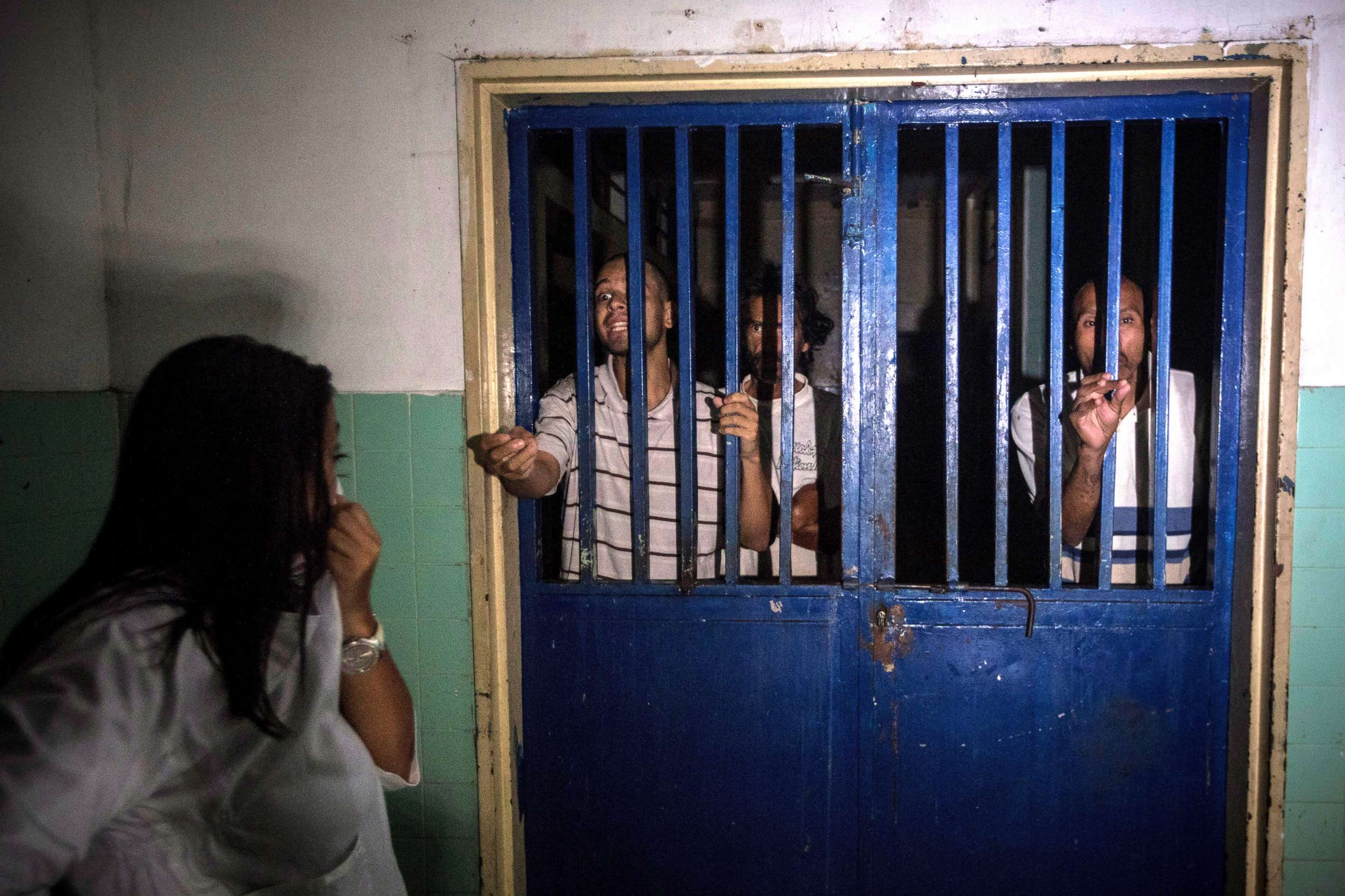PHOTO: Mental health patients stand behind the bars of their room at the Caracas Psychiatric Hospital, in Caracas, Venezuela, July 14, 2019. 
