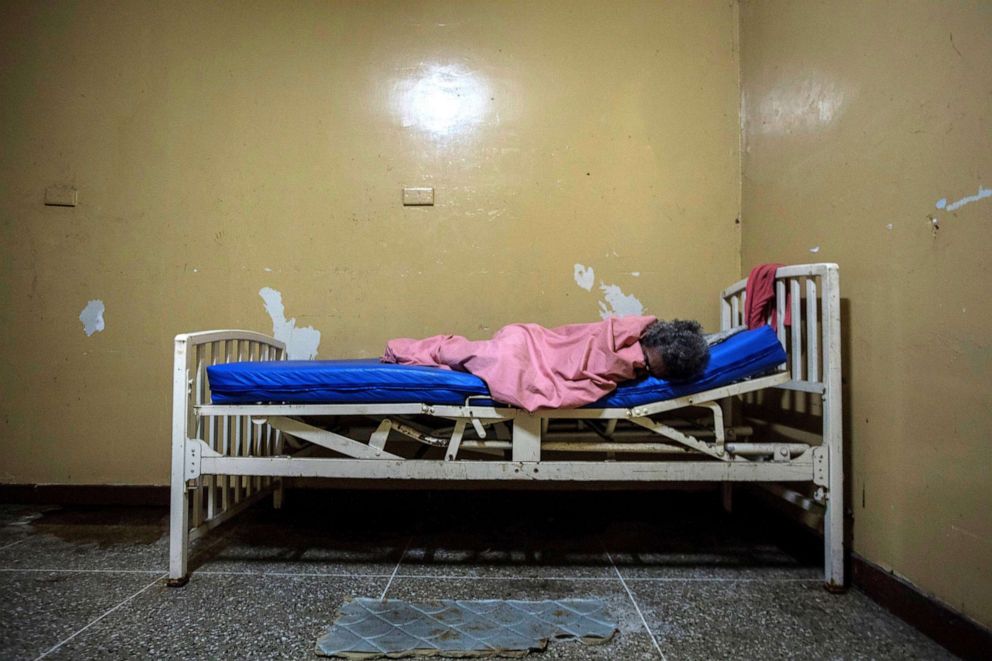 PHOTO: A mental health patient lies on a bed at the Caracas Psychiatric Hospital, in Caracas, Venezuela, July 14, 2019.