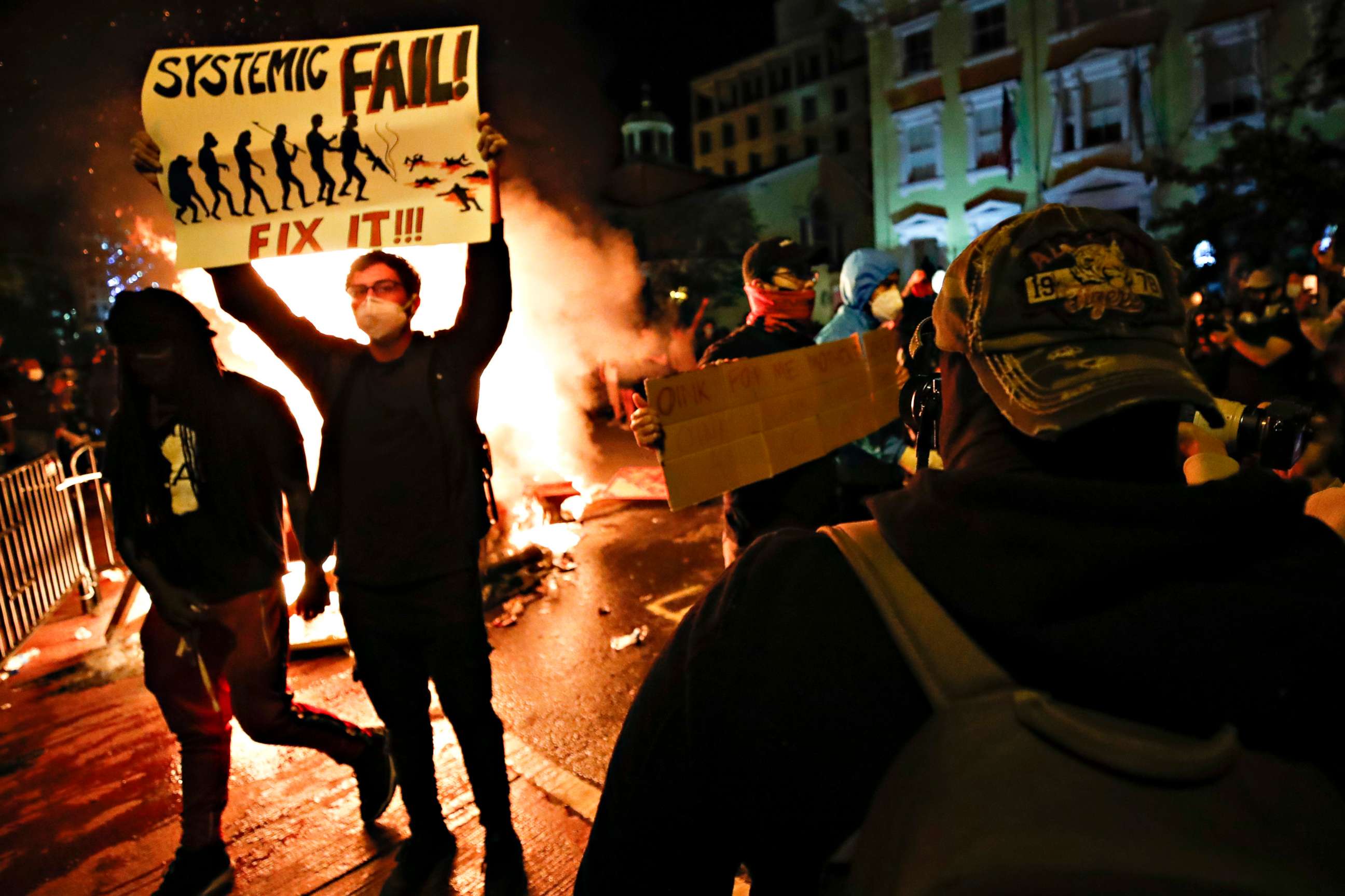 PHOTO: Demonstrators protest the death of George Floyd, May 31, 2020, near the White House in Washington.