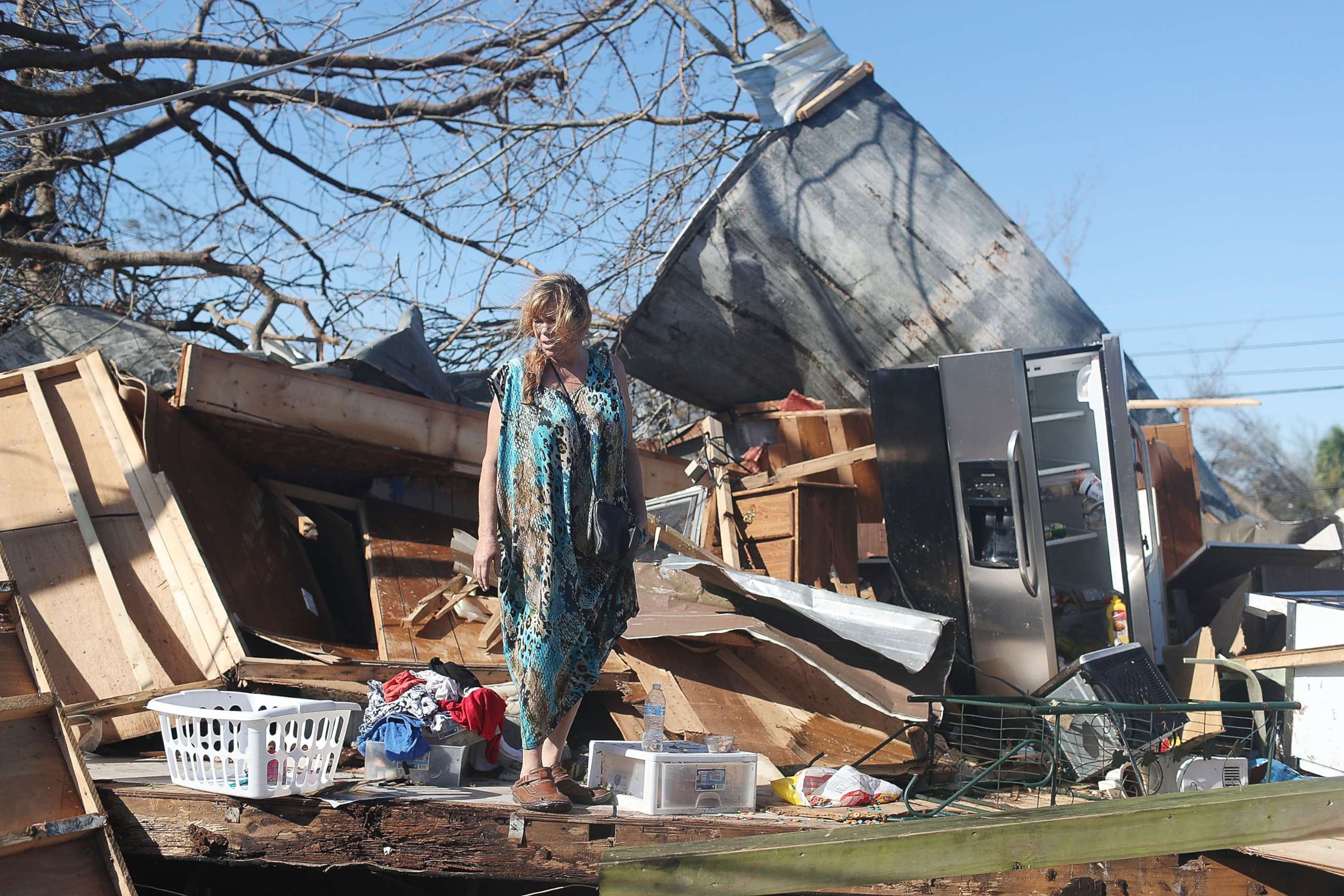 PHOTO: Kathy Coy stands among what is left of her home after Hurricane Michael destroyed it on Oct. 11, 2018 in Panama City, Florida. She said she was in the home when it was blown apart and is thankful to be alive. 