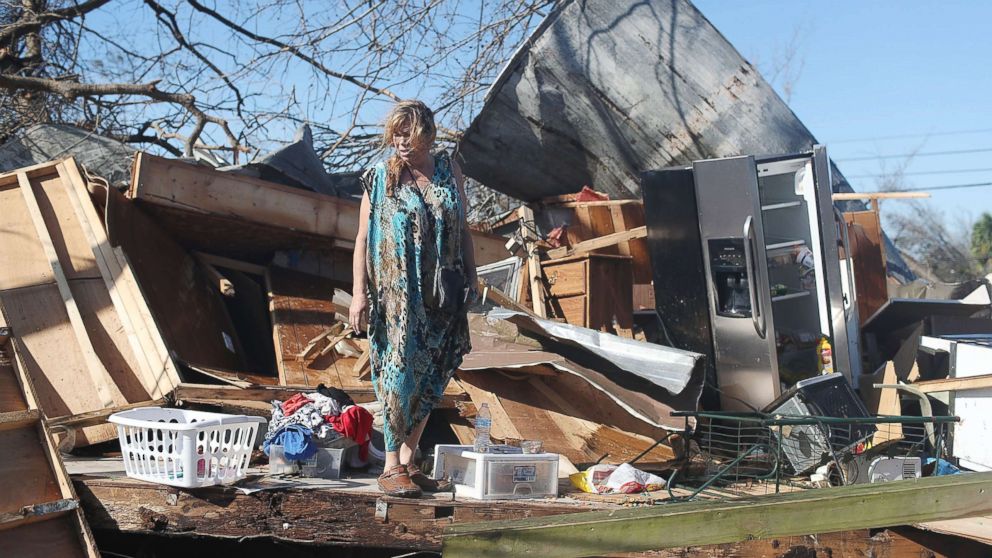 PHOTO: Kathy Coy stands among what is left of her home after Hurricane Michael destroyed it on Oct. 11, 2018 in Panama City, Florida. She said she was in the home when it was blown apart and is thankful to be alive. 