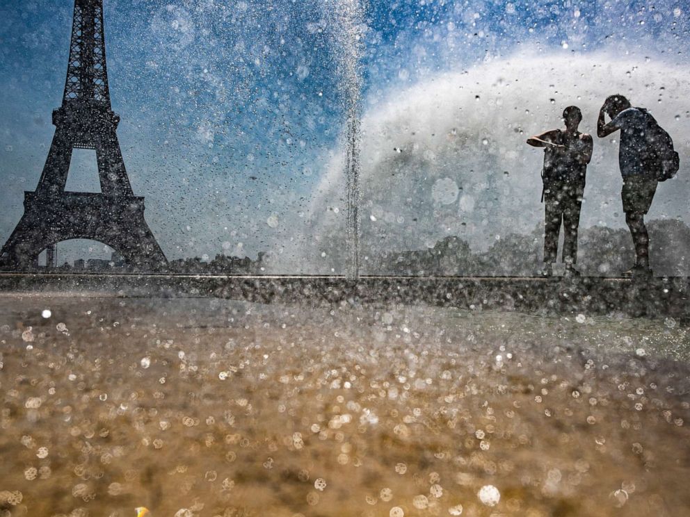 PHOTO: People cool down at the Gardens of the Trocadero in Paris, July 23, 2019.