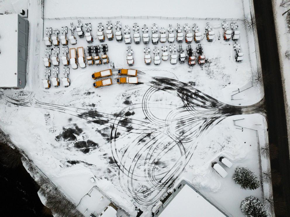 PHOTO: In an aerial view, trucks covered in snow sit parked on Dec. 5, 2024 in Watertown, New York. 