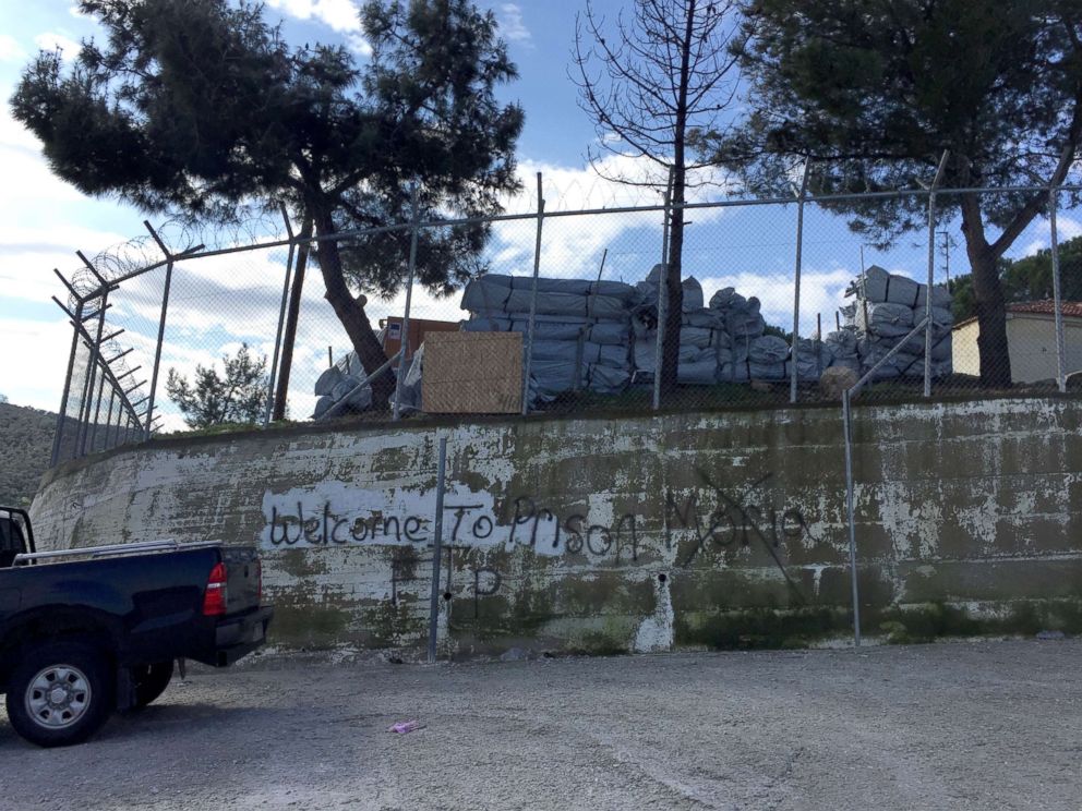 PHOTO: The words "Welcome to Prison" are spray-painted on the wall that surrounds the Moria refugee camp on the Greek island of Lesbos.