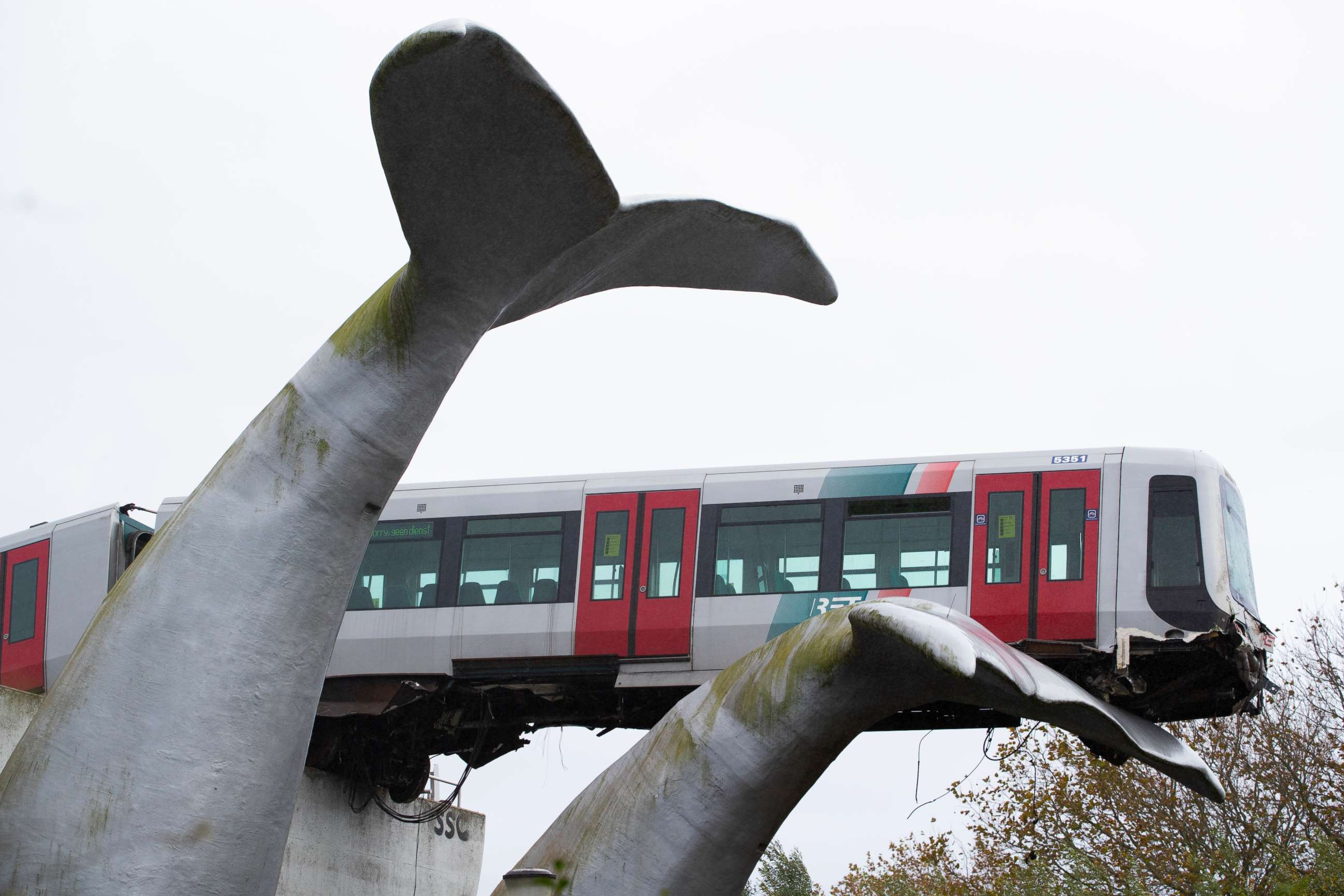 PHOTO: The whale's tail of a sculpture caught the front carriage of a metro train as it rammed through the end of an elevated section of rails with the driver escaping injuries in Spijkenisse, near Rotterdam, Netherlands, Monday, Nov. 2, 2020.