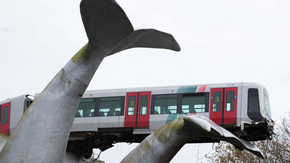 PHOTO: The whale's tail of a sculpture caught the front carriage of a metro train as it rammed through the end of an elevated section of rails with the driver escaping injuries in Spijkenisse, near Rotterdam, Netherlands, Monday, Nov. 2, 2020.